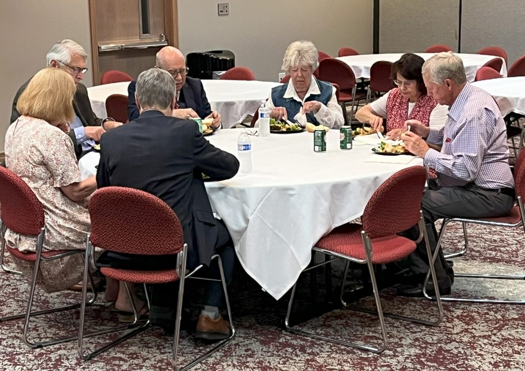 People eating lunch at a round table at the Utah State Bar luncheon honoring distinguished licensees who have served 50 years in the legal profession