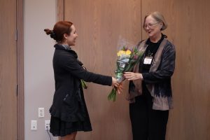 Kimberly Farnsworth presents Christine Durham with flowers