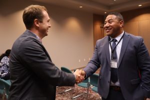 A2J Summit - two male attorneys shaking hands